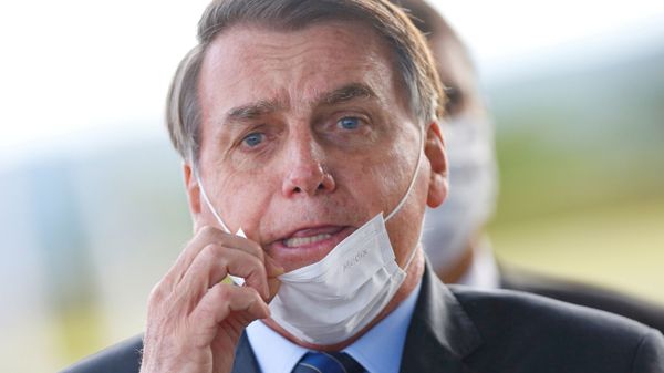 Brazil's President Jair Bolsonaro adjusts his mask as he leaves Alvorada Palace, amid the coronavirus disease (COVID-19) outbreak in Brasilia, Brazil May 13, 2020 Brazil's President Jair Bolsonaro adjusts his mask as he leaves Alvorada Palace, amid the coronavirus disease (COVID-19) outbreak in Brasilia, Brazil May 13, 2020 - Sputnik International