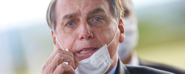 Brazil's President Jair Bolsonaro adjusts his mask as he leaves Alvorada Palace, amid the coronavirus disease (COVID-19) outbreak in Brasilia, Brazil May 13, 2020 Brazil's President Jair Bolsonaro adjusts his mask as he leaves Alvorada Palace, amid the coronavirus disease (COVID-19) outbreak in Brasilia, Brazil May 13, 2020 - Sputnik International
