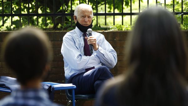Democratic presidential candidate, former Vice President Joe Biden, center, speaks to Stacie Ritter, right, and her son, Jan, during a meeting with families who have benefited from the Affordable Care Act, Thursday, June 25, 2020 - Sputnik International