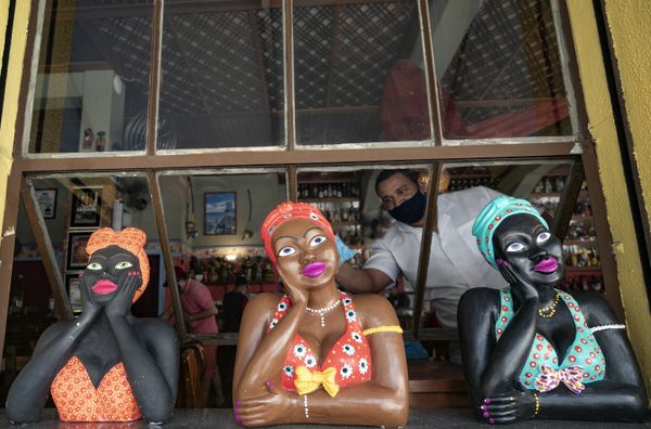 A restaurant worker wearing a mask cleans windows as the restaurant reopens amid the COVID-19 pandemic in Sao Paulo, Brazil, Monday, 6 July 2020. Bars, restaurants, and beauty salons were allowed to reopen Monday after over three months of quarantine, and are required to observe preventative measures and reduced operating hours only during the day. A restaurant worker wearing a mask cleans windows as the restaurant reopens amid the COVID-19 pandemic in Sao Paulo, Brazil, Monday, 6 July 2020. Bars, restaurants, and beauty salons were allowed to reopen Monday after over three months of quarantine, and are required to observe preventative measures and reduced operating hours only during the day. - Sputnik International