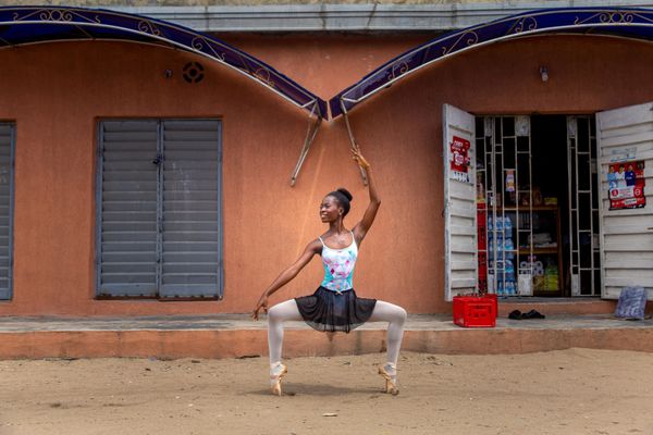A student at the Leap of Dance Academy, Olamide Olawale, performs a dance routine on Okelola Street in Ajangbadi, Lagos, on 3 July 2020. The Leap of Dance Academy is a ballet school in a poor district of the sprawling megacity of Lagos that aims to bring classical dance to underprivileged children in Africa's most populous nation. A student at the Leap of Dance Academy, Olamide Olawale, performs a dance routine on Okelola Street in Ajangbadi, Lagos, on 3 July 2020. The Leap of Dance Academy is a ballet school in a poor district of the sprawling megacity of Lagos that aims to bring classical dance to underprivileged children in Africa's most populous nation. - Sputnik International