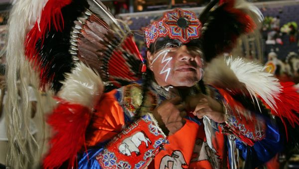 Native American Dwight White Buffalo, a Cheyenne from Watonga, Oklahoma, prepares for the opening of the National Pow Wow 12 August 2005 at the MCI Center in Washington, DC - Sputnik International