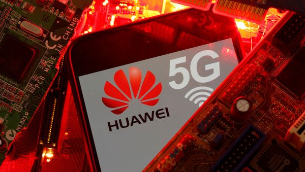 A smartphone with the Huawei and 5G network logo is seen on a PC motherboard in this illustration picture taken January 29, 2020 A smartphone with the Huawei and 5G network logo is seen on a PC motherboard in this illustration picture taken January 29, 2020 - Sputnik International