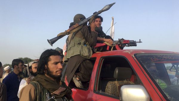 Taliban fighters ride in their vehicle in Surkhroad district of Nangarhar province, east of Kabul, Afghanistan, Saturday, June 16, 2018 - Sputnik International