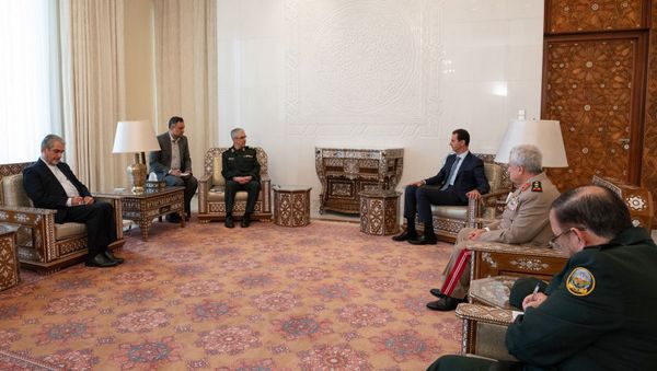 A handout picture released by the official Syrian presidency Telegram page on July 9, 2020 shows President Bashar al-Assad (3rd-R) receiving Iranian Armed Forces Chief of Staff Major General Mohammad Bagheri and the accompanying delegation in Damascus - Sputnik International