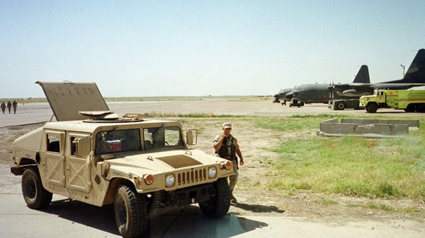 U.S. Army soldier walks past a Humvee vehicle at the Karshi-Khanabad air base, Uzbekistan, in this Tuesday, May 28, 2002 - Sputnik International