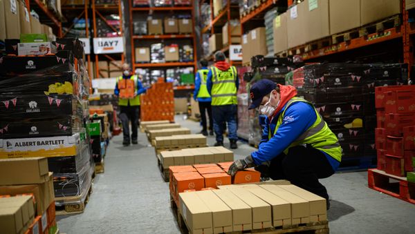 Staff for the charity 'His Church' prepare pallets of food and supplies which will be distributed to charities and community support networks across the UK from their warehouse near Market Rasen, northern England on April 14, 2020 Staff for the charity 'His Church' prepare pallets of food and supplies which will be distributed to charities and community support networks across the UK from their warehouse near Market Rasen, northern England on April 14, 2020 - Sputnik International