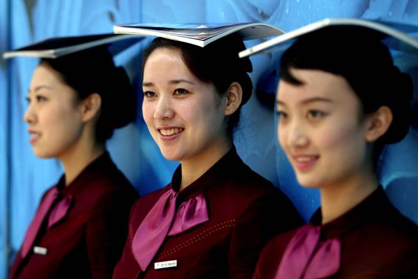 In this photo released by China's Xinhua News Agency, some stewardesses of Shenyang Taoxian International Airport receive Olympic etiquette training, Shenyang, northeast China's Liaoning Province, Thursday, April 3, 2008 In this photo released by China's Xinhua News Agency, some stewardesses of Shenyang Taoxian International Airport receive Olympic etiquette training, Shenyang, northeast China's Liaoning Province, Thursday, April 3, 2008 - Sputnik International