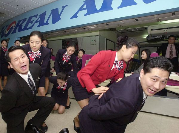 Korean Airline stewardess tackle their colleagues acting as unruly passengers during a martial art training in Seoul, 21 March 2001 Korean Airline stewardess tackle their colleagues acting as unruly passengers during a martial art training in Seoul, 21 March 2001 - Sputnik International
