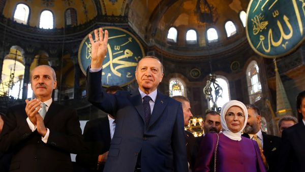 Turkish President Tayyip Erdogan accompanied by his wife Emine Erdogan attends the opening ceremony of the Yeditepe Biennial at the Hagia Sophia or Ayasofya Museum in Istanbul, Turkey, 31 March 2018. - Sputnik International