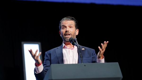 Donald Trump Jr. speaks to young people waiting to hear his father, U.S. President Donald Trump, deliver an Address to Young Americans at the Dream City Church in Phoenix, Arizona, U.S., June 23, 2020. - Sputnik International