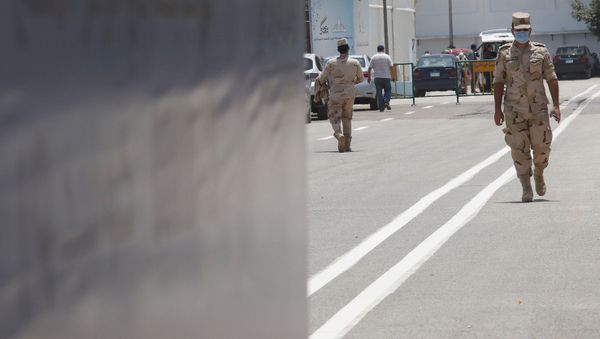 Egyptian army members wearing protective face masks, amid concerns over the coronavirus disease (COVID-19) complete a new area at the Ain Shams field hospital prepared to receive COVID-19 patients in Cairo, Egypt June 16, 2020 - Sputnik International