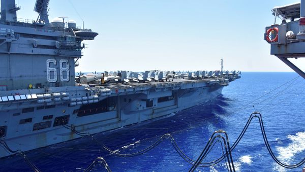 The U.S. Navy aircraft carrier USS Nimitz receives fuel from the Henry J. Kaiser-class fleet replenishment oiler USNS Tippecanoe during an underway replenishment in the South China Sea July 7, 2020. Picture taken July 7, 2020 - Sputnik International