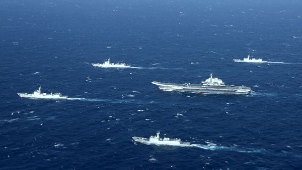 This aerial file photo taken on January 2, 2017 shows a Chinese Navy formation, including the aircraft carrier Liaoning (C), during military drills in the South China Sea. This aerial file photo taken on January 2, 2017 shows a Chinese Navy formation, including the aircraft carrier Liaoning (C), during military drills in the South China Sea. - Sputnik International