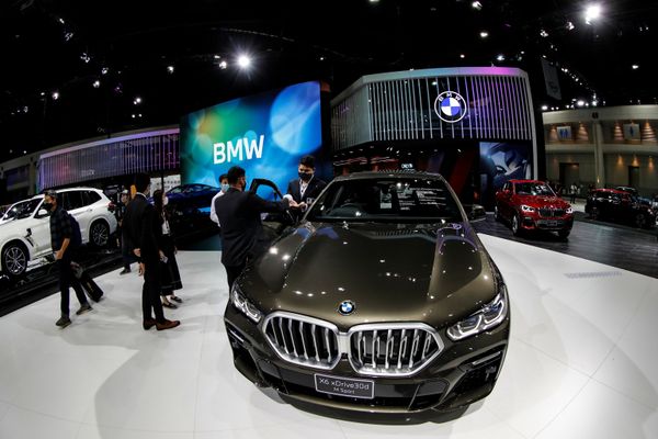 People wearing face masks are seen near the BMW X6 xDrive30d M Sport during the media day of the 41st Bangkok International Motor Show after the Thai government eased measures to prevent the spread of the coronavirus disease (COVID-19) in Bangkok, Thailand July 14, 2020. People wearing face masks are seen near the BMW X6 xDrive30d M Sport during the media day of the 41st Bangkok International Motor Show after the Thai government eased measures to prevent the spread of the coronavirus disease (COVID-19) in Bangkok, Thailand July 14, 2020. - Sputnik International
