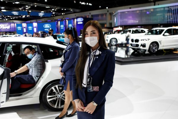 A representative of a BMW dealership wears a face mask during the media day of the 41st Bangkok International Motor Show after the Thai government eased measures to prevent the spread of the coronavirus disease (COVID-19) in Bangkok, Thailand July 14, 2020. A representative of a BMW dealership wears a face mask during the media day of the 41st Bangkok International Motor Show after the Thai government eased measures to prevent the spread of the coronavirus disease (COVID-19) in Bangkok, Thailand July 14, 2020. - Sputnik International