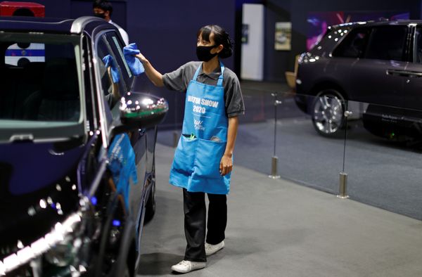A staff member cleans a vehicle during the media day of the 41st Bangkok International Motor Show after the Thai government eased measures to prevent the spread of the coronavirus disease (COVID-19) in Bangkok, Thailand July 14, 2020. A staff member cleans a vehicle during the media day of the 41st Bangkok International Motor Show after the Thai government eased measures to prevent the spread of the coronavirus disease (COVID-19) in Bangkok, Thailand July 14, 2020. - Sputnik International