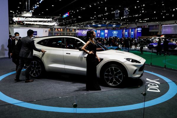 A model wearing a face shield poses with an Aston Martin DBX during the media day of the 41st Bangkok International Motor Show after the Thai government eased measures to prevent the spread of the coronavirus disease (COVID-19) in Bangkok, Thailand July 14, 2020. A model wearing a face shield poses with an Aston Martin DBX during the media day of the 41st Bangkok International Motor Show after the Thai government eased measures to prevent the spread of the coronavirus disease (COVID-19) in Bangkok, Thailand July 14, 2020. - Sputnik International