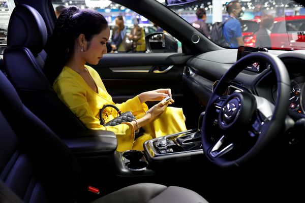 A customer sits in a Mazda CX-8 during the media day of the 41st Bangkok International Motor Show after the Thai government eased measures to prevent the spread of the coronavirus disease (COVID-19) in Bangkok, Thailand July 14, 2020. A customer sits in a Mazda CX-8 during the media day of the 41st Bangkok International Motor Show after the Thai government eased measures to prevent the spread of the coronavirus disease (COVID-19) in Bangkok, Thailand July 14, 2020. - Sputnik International