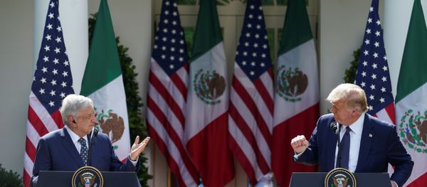 U.S. President Donald Trump listens to Mexico's President Andres Manuel Lopez Obrado as the leaders deliver individual statements prior to signing a joint declaration in the Rose Garden at the White House in Washington, U.S., July 8, 2020 - Sputnik International
