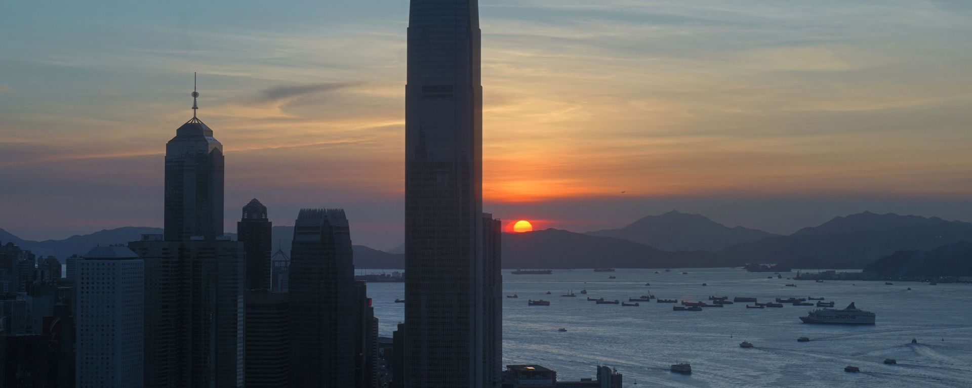 The skyline of the business district is silhouetted at sunset in Hong Kong Monday, 13 July 2020. - Sputnik International, 1920, 11.03.2021