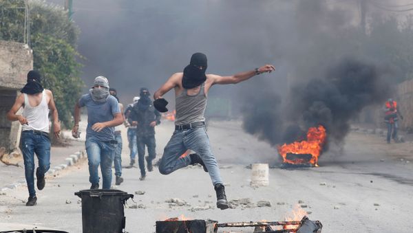A demonstrator jumps during an anti-Israel protest following the funeral of Palestinian man Ibraheem Yakoub, in Kifl Haris in the Israeli-occupied West Bank, 10 July 2020 A demonstrator jumps during an anti-Israel protest following the funeral of Palestinian man Ibraheem Yakoub, in Kifl Haris in the Israeli-occupied West Bank, 10 July 2020 - Sputnik International