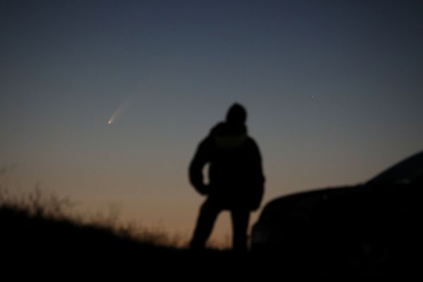 A person is looking at the Comet C/2020 or Neowise, which is seen in the sky over Ballintoy, Britain July 8, 2020, in this picture taken from a social media. Picture taken July 8, 2020 - Sputnik International