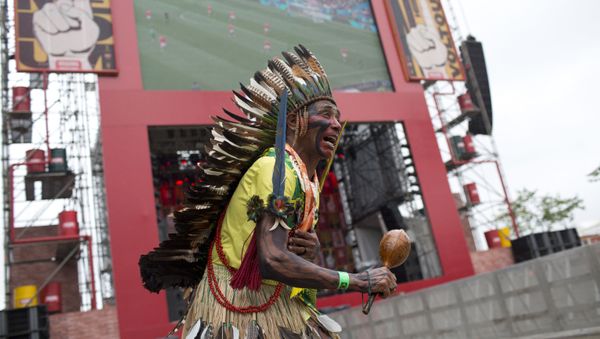 Akazu Tabajara Tapeba dances in front of an outdoors television screen during the group A, 2018 soccer World Cup opening match between Russia and Saudi Arabia, at Praca Maua, in Rio de Janeiro, Brazil, Thursday, June 14, 2018 - Sputnik International