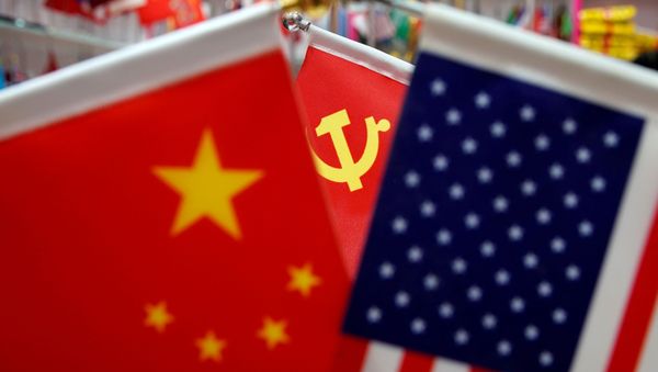 The flags of China, U.S. and the Chinese Communist Party are displayed in a flag stall at the Yiwu Wholesale Market in Yiwu, Zhejiang province, China, May 10, 2019. - Sputnik International