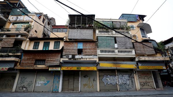 Closed shops are seen on an empty Hang Duong street which was previously one of the most busy streets during the coronavirus disease (COVID-19) outbreak in Hanoi, Vietnam - Sputnik International