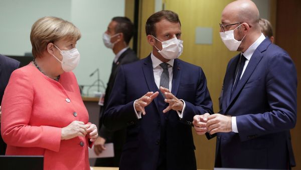 Germany's Chancellor Angela Merkel, French President Emmanuel Macron and European Council President Charles Michel talk at the start of the first face-to-face EU summit since the coronavirus disease (COVID-19) outbreak, in Brussels, Belgium17  July 2020. - Sputnik International