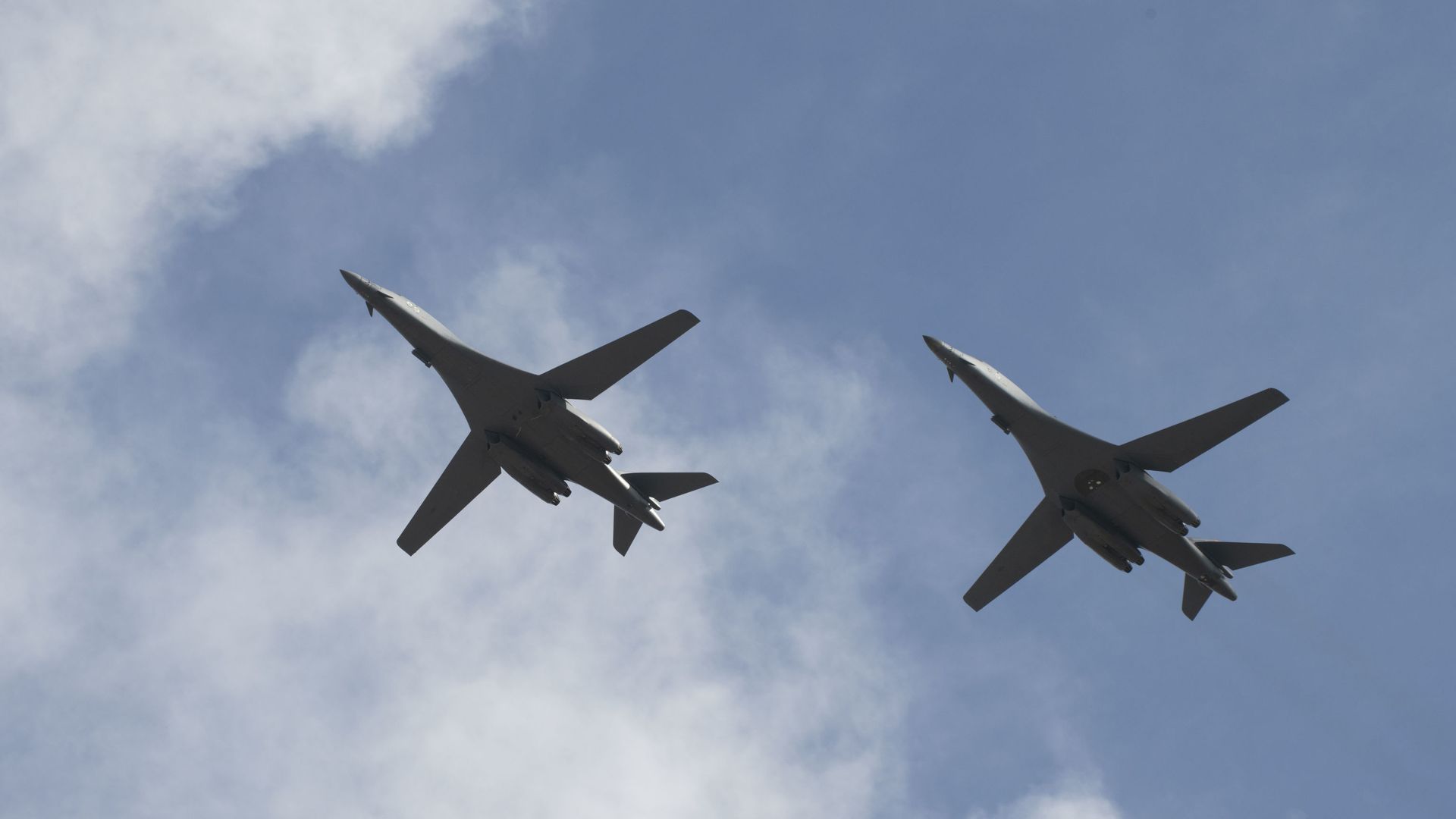 Two B-1B Lancers, assigned to the 28th Bomb Wing, Ellsworth Air Force Base, S.D., conduct a flyover before landing at Andersen AFB, Guam, July 17, 2020. The Bomber Task Force is deployed to Andersen AFB in support of Pacific Air Forces’ training efforts with allies, partners and joint forces. (U.S. Air Force Photo by Airman 1st Class Christina Bennett) Two B-1B Lancers, assigned to the 28th Bomb Wing, Ellsworth Air Force Base, S.D., conduct a flyover before landing at Andersen AFB, Guam, July 17, 2020. The Bomber Task Force is deployed to Andersen AFB in support of Pacific Air Forces’ training efforts with allies, partners and joint forces. (U.S. Air Force Photo by Airman 1st Class Christina Bennett) - Sputnik International, 1920, 20.06.2023