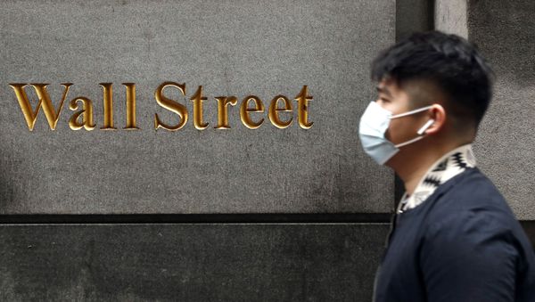A man wears a protective mask as he walks on Wall Street during the coronavirus outbreak in New York City, New York, U.S., March 13, 2020 A man wears a protective mask as he walks on Wall Street during the coronavirus outbreak in New York City, New York, U.S., March 13, 2020 - Sputnik International