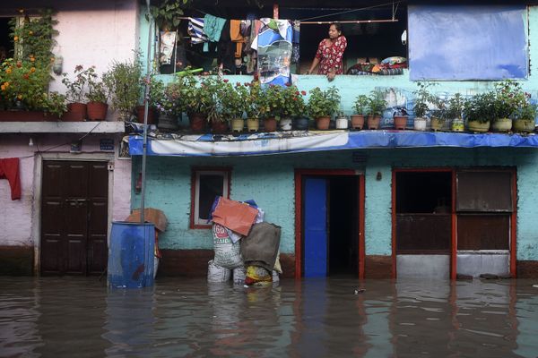 A resident stands from her balcony as the Bagmati River overflowed following monsoon rains in Kathmandu on July 20, 2020 A resident stands from her balcony as the Bagmati River overflowed following monsoon rains in Kathmandu on July 20, 2020 - Sputnik International