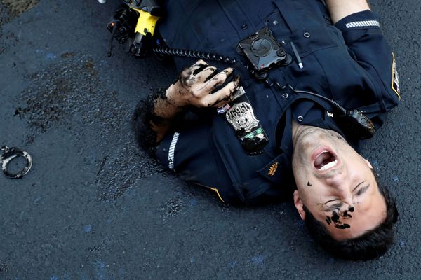 An officer from the New York Police Department is seen injured after attempting to detain a protester smearing paint on the Black Lives Matter mural outside of Trump Tower on Fifth Avenue in Manhattan, New York City, US, July 18, 2020 An officer from the New York Police Department is seen injured after attempting to detain a protester smearing paint on the Black Lives Matter mural outside of Trump Tower on Fifth Avenue in Manhattan, New York City, US, July 18, 2020 - Sputnik International
