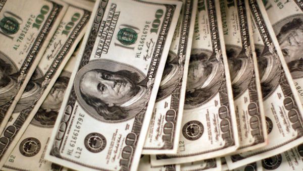 Four thousand U.S. dollars are counted out by a banker counting currency at a bank in Westminster, Colorado November 3, 2009 Four thousand U.S. dollars are counted out by a banker counting currency at a bank in Westminster, Colorado November 3, 2009 - Sputnik International