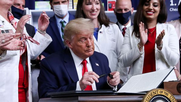 U.S. President Donald Trump signs an executive order on lowering drug prices during a ceremony in the Eisenhower Executive Office Building at the White House in Washington, U.S., July 24, 2020. - Sputnik International