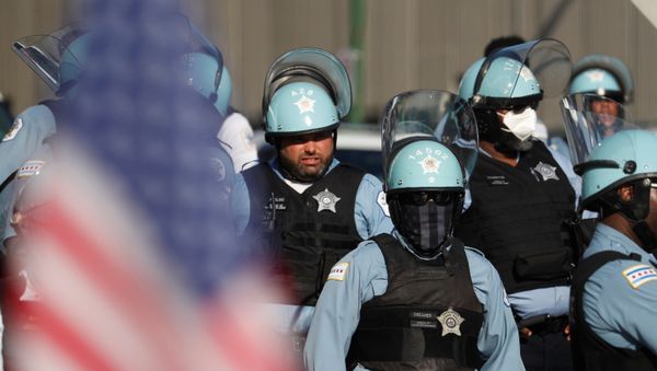 Police officers stand outside Homan Square Police station near of a demonstration against police violence and racial inequality in Chicago, Illinois, U.S., July 24, 2020 - Sputnik International