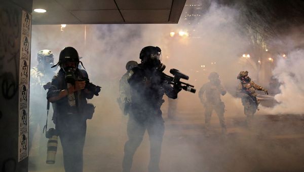 Police officers as demonstrators protest against racial inequality and police violence in Portland Police officers as demonstrators protest against racial inequality and police violence in Portland - Sputnik International