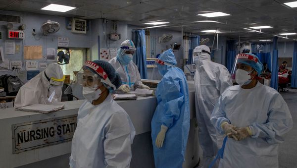 Medical workers wearing personal protective equipment (PPE) are seen inside an Intensive Care Unit (ICU) for patients suffering from the coronavirus disease - Sputnik International