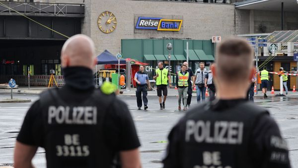 Officials walk past a car which crashed into a group of seven people at Bahnhof Zoo train station in Berlin Officials walk past a car which crashed into a group of seven people at Bahnhof Zoo train station in Berlin - Sputnik International