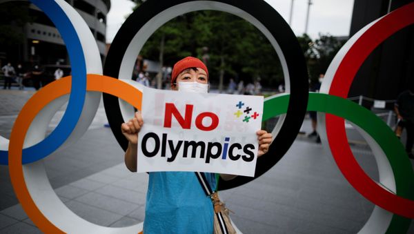 A woman demonstrating against the Olympics being held in Tokyo in 2021 A woman demonstrating against the Olympics being held in Tokyo in 2021 - Sputnik International