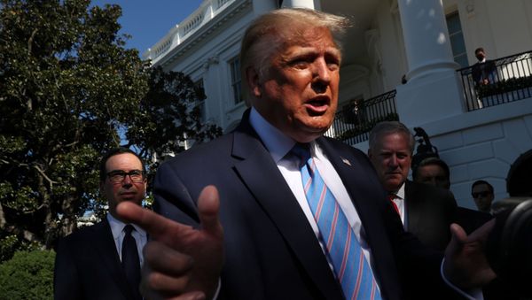 U.S. Treasury Secretary Steven Mnuchin (L) and White House Chief of Staff Mark Meadows stand behind U.S. President Donald Trump as he speaks to the news media before departing for Marine One for travel to Midland, Texas from the South Lawn of the White House in Washington, U.S., July 29, 2020. U.S. Treasury Secretary Steven Mnuchin (L) and White House Chief of Staff Mark Meadows stand behind U.S. President Donald Trump as he speaks to the news media before departing for Marine One for travel to Midland, Texas from the South Lawn of the White House in Washington, U.S., July 29, 2020. - Sputnik International