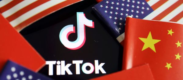 China and U.S. flags are seen near a TikTok logo in this illustration picture taken July 16, 2020 - Sputnik International
