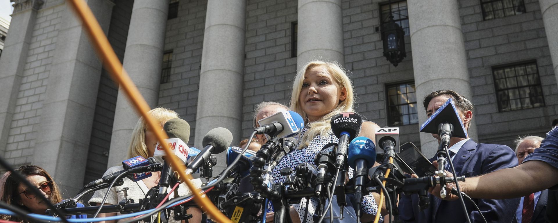 Virginia Roberts Giuffre, center, who says she was trafficked by sex offender Jeffrey Epstein, holds a news conference outside a Manhattan court Virginia Roberts Giuffre, center, who says she was trafficked by sex offender Jeffrey Epstein, holds a news conference outside a Manhattan court - Sputnik International, 1920, 14.01.2022