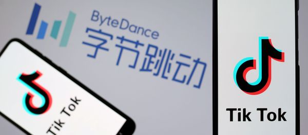 TikTok logos are seen on smartphones in front of a displayed ByteDance logo in this illustration taken November 27, 2019. - Sputnik International