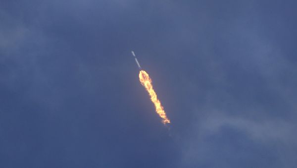SpaceX Falcon 9 lifts off with NASA astronauts Doug Hurley and Bob Behnken in the Dragon crew capsule, Saturday, May 30, 2020 from the Kennedy Space Center at Cape Canaveral, Fla. The two astronauts are on the SpaceX test flight to the International Space Station. For the first time in nearly a decade, astronauts blasted towards orbit aboard an American rocket from American soil, a first for a private company - Sputnik International