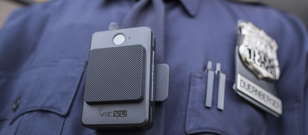 A police officer wears a newly issued body camera outside the 34th precinct, Thursday, April 27, 2017, in New York. The New York Police Department is launching the first phase of a plan to equip 22,000 officers with body cameras - Sputnik International