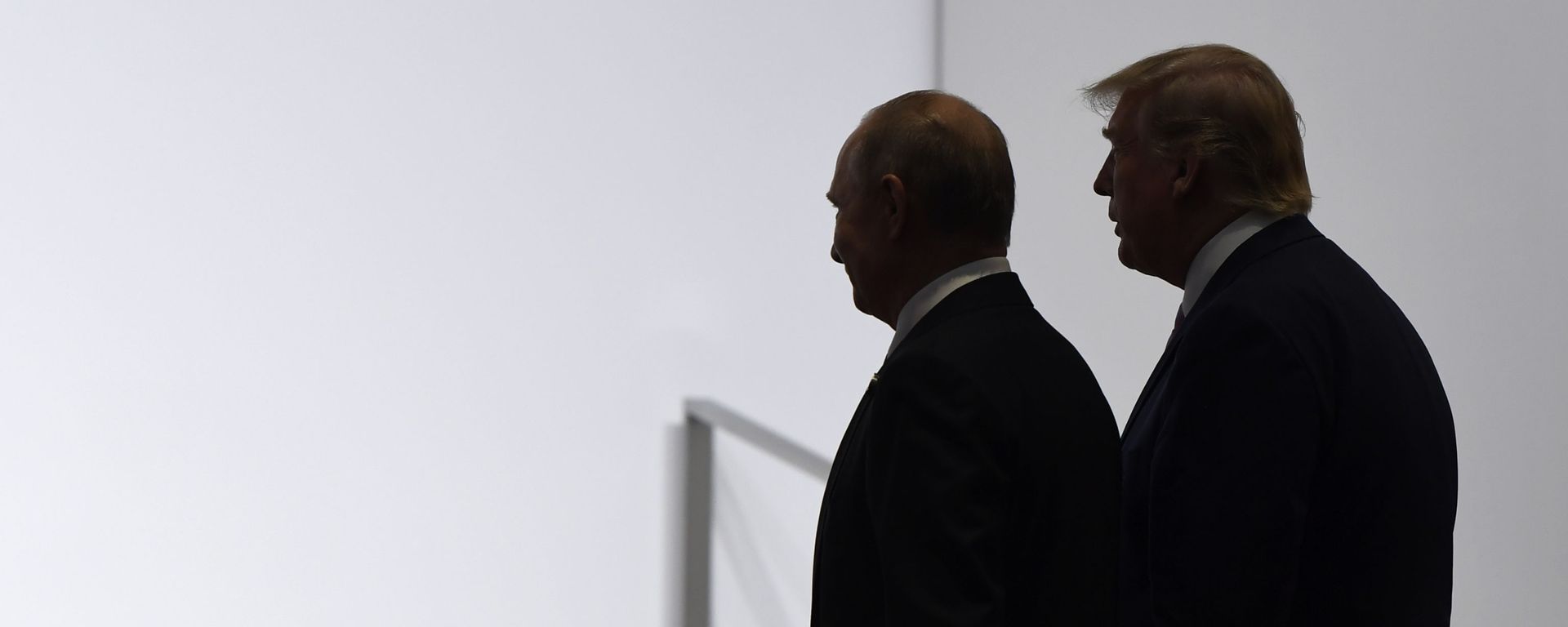 President Donald Trump and Russian President Vladimir Putin walk to participate in a group photo at the G20 summit in Osaka, Japan, Friday, June 28, 2019 - Sputnik International, 1920, 12.08.2025