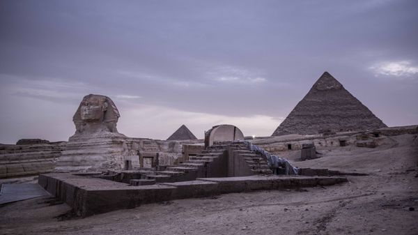 This March 30, 2020 file photo, shows the empty Giza Pyramids and Sphinx complex on lockdown due to the coronavirus outbreak in Egypt. In July, fearing further economic fallout, the government reopened much of society and welcomed hundreds of international tourists back to resorts, even as daily reported deaths exceeded 80. Restaurants and cafes are reopening with some continued restrictions, and masks have been mandated in public - Sputnik International